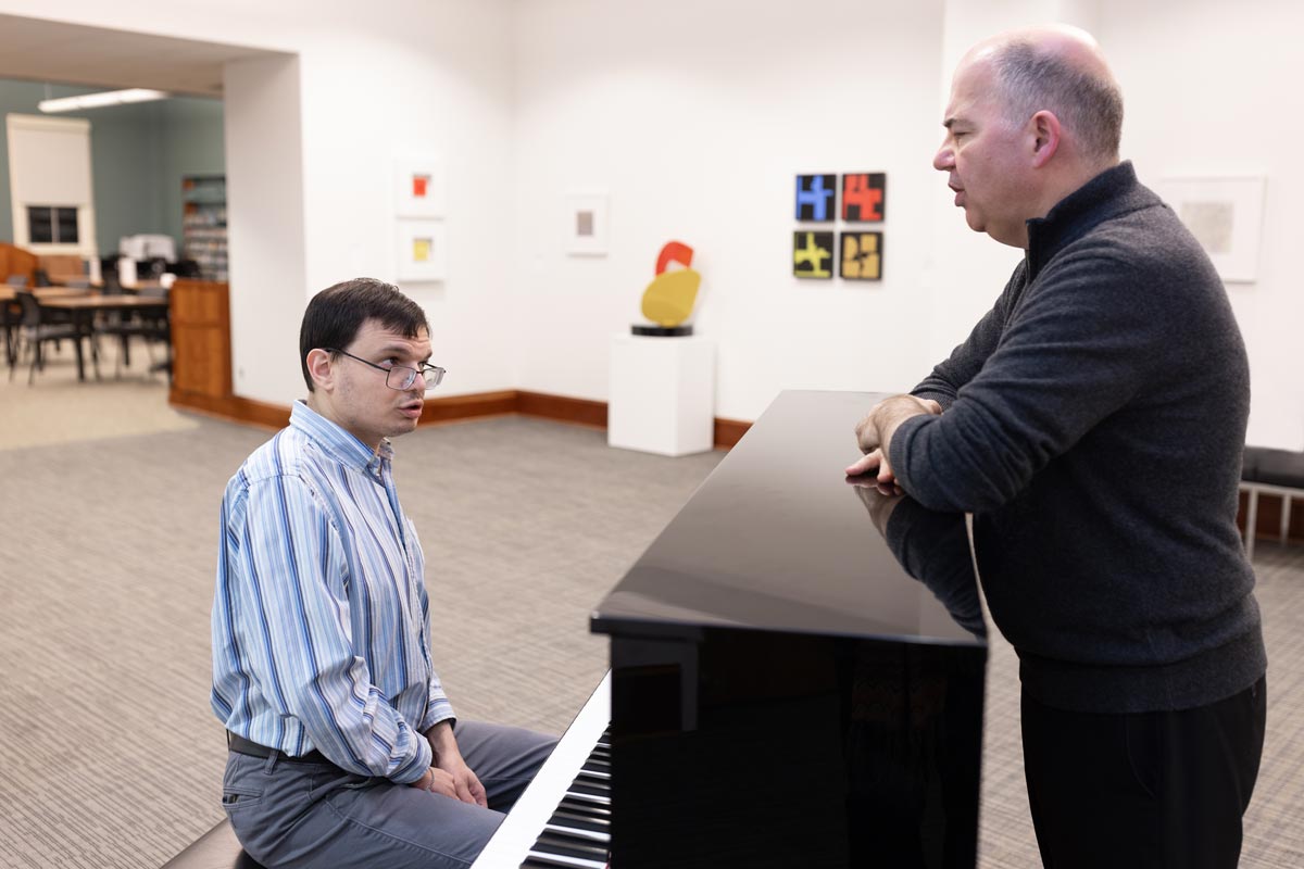 Peter Muir with Michael in a lesson