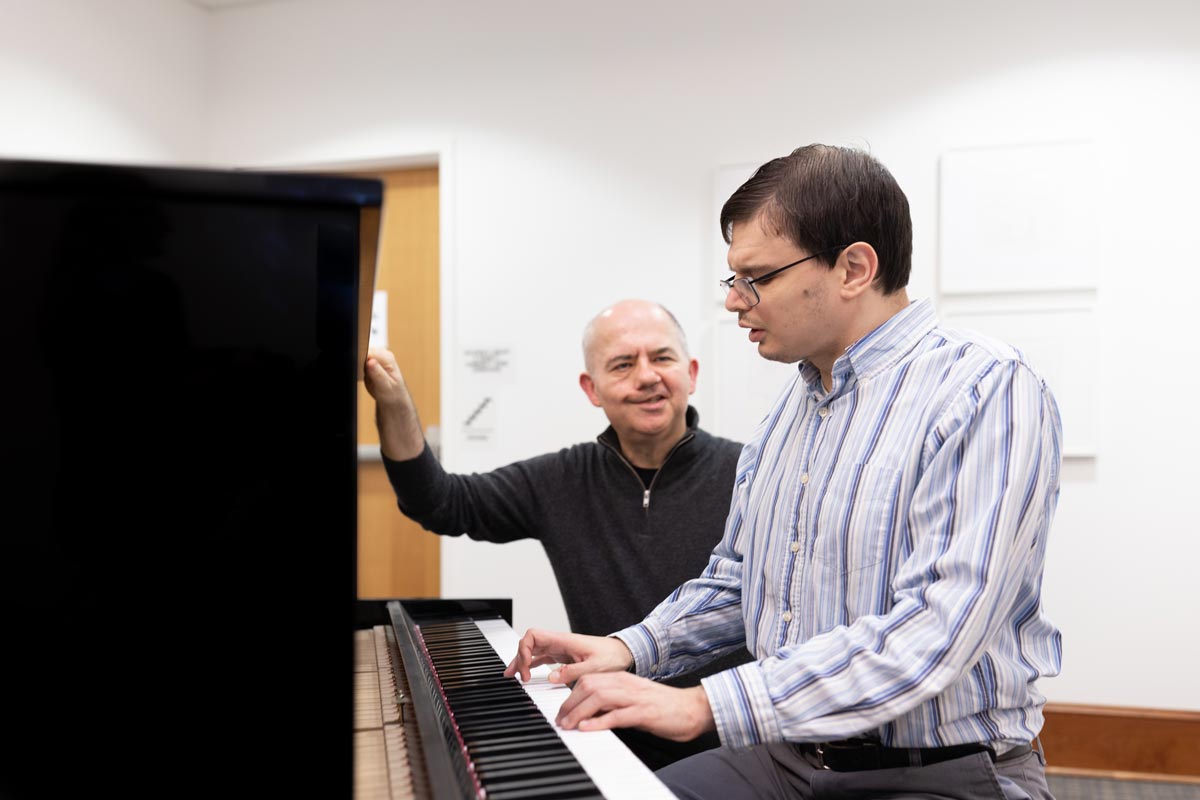 Peter Muir with Michael in a lesson