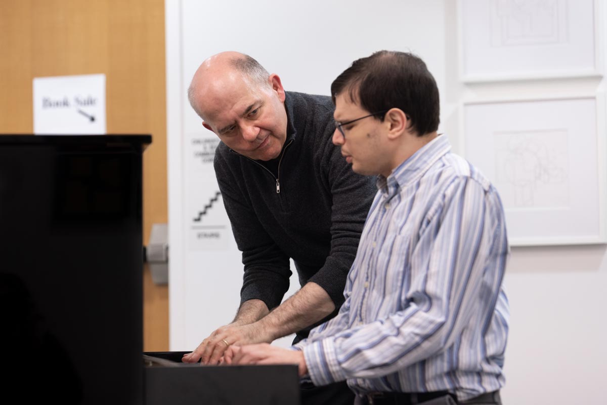 Peter Muir with Michael in a lesson